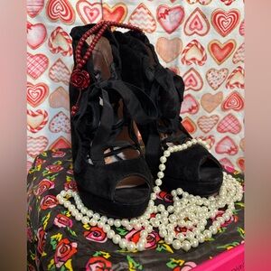 2 1/2 inch black suede heels.